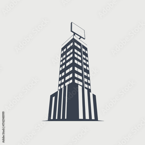 Silhouette of a tall building with a billboard on top, viewed from a low angle.