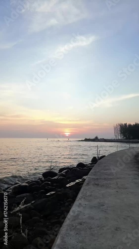 sea barrier with sunrise