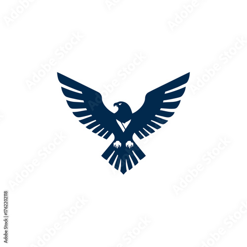 Powerful stylized dark blue eagle silhouette in flight. Majestic bird of prey with open wings, symbol of freedom, strength, and vision.