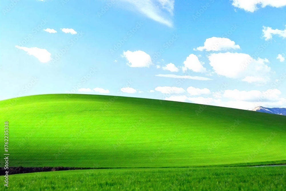 Obraz premium Serene Rolling Hills Landscape Lush Green Grass, Blue Sky, Peaceful Tranquility, Perfect for Relaxation and Rest