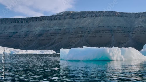 Observe the breathtaking melting ice formations in Greenland as climate change reshapes the landscape. This striking transformation highlights the urgent need for action in our world.
