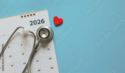  top view on red heart symbol and stethoscope on calendar  2026 with over blue background for design about ads or banner of doctor appointment and health checkup following personal lifestyle concept