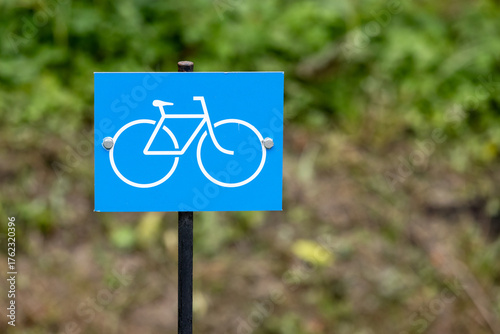 Bicycle lane. Bright blue square sign with a white bicycle icon
