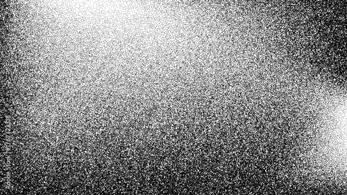 Black and white grainy texture with gradient. Abstract grunge background with stipple effect. Halftone dot pattern for graphic design or overlay backdrop.