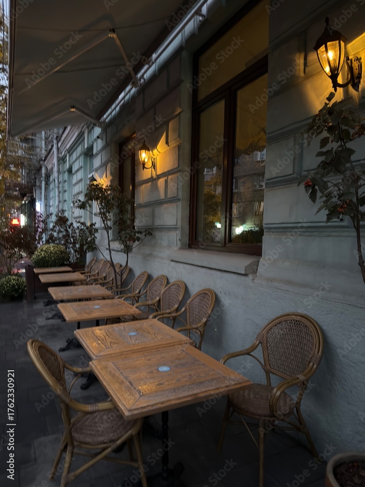 Naklejka premium Cozy Outdoor Café Terrace at Dusk