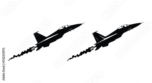 Two sleek fighter jets in flight leaving trails across the sky