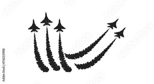 Silhouette of military jets leaving white smoke trails in the sky