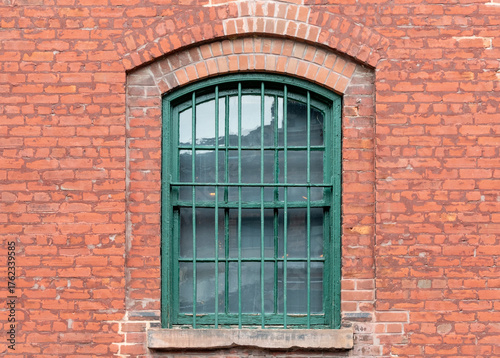 Photography old green window with red brick wall at distillery district Toronto Ontario