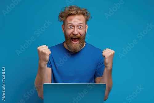 Overjoyed Man Celebrating Success with His Laptop