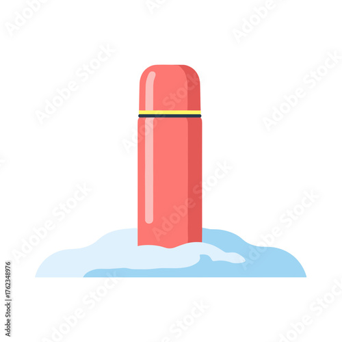 Red thermos resting in snow during winter season  