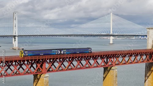Trains on Forth Bridge from a drone, Queensferry Crossing, Forth Estuary, Scotland