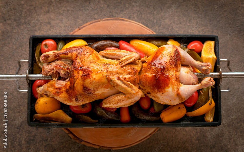 Naklejka premium Peruvian cuisine. Pollo a la brasa – chicken cooked on a spit. Top view