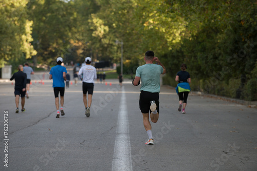 Back view of a group of people running