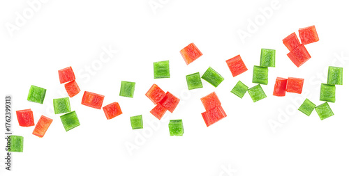 Red and green bell pepper pieces isolated on a white background, top view. Mixed paprika cubes.