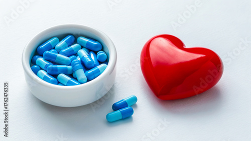 Blue medical capsules - tablets on a white background.