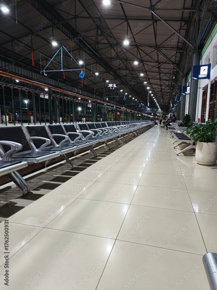 Fototapeta premium Empty Train Station Platform and Rail Tracks