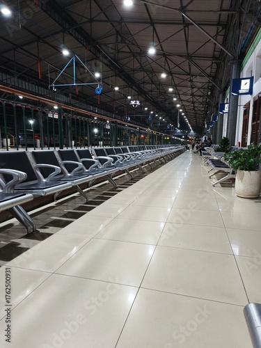 Empty Train Station Platform and Rail Tracks