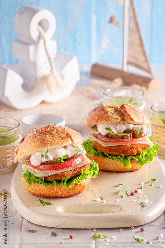 Tasty fish burger with toma...