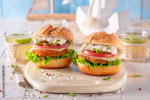 Fish burger with tomatoes, ...