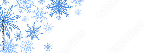 Vector illustration of blue snowflakes arranged in the top left corner on a white background. Minimal winter border design for Christmas cards, invitations, posters, or seasonal decoration