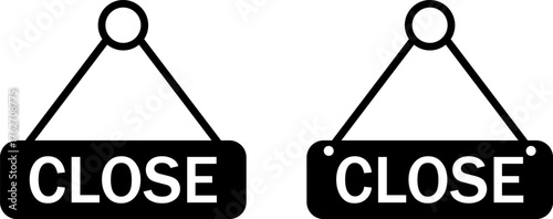 Two black and white hanging signs indicating business closure