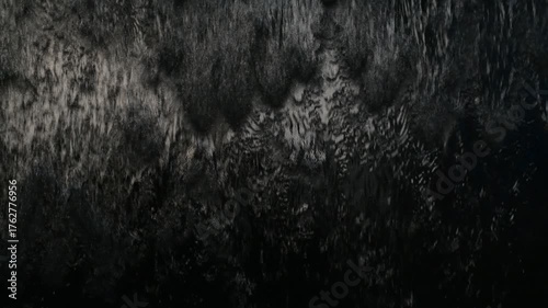 Black water wall, dark water feature, black fountain wall.