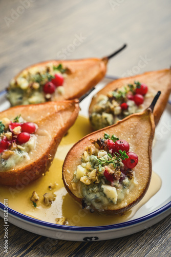 Delicious baked pears with nuts, blue cheese, thyme, cranberry and honey