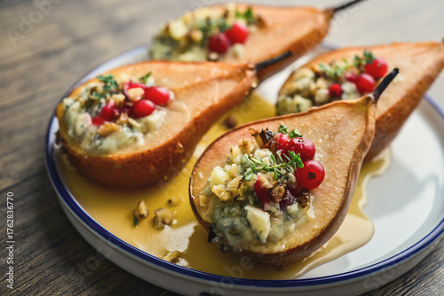Delicious baked pears with nuts, blue cheese, thyme, cranberry and honey