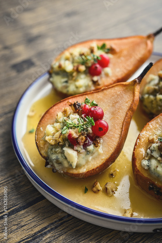 Delicious baked pears with nuts, blue cheese, thyme, cranberry and honey
