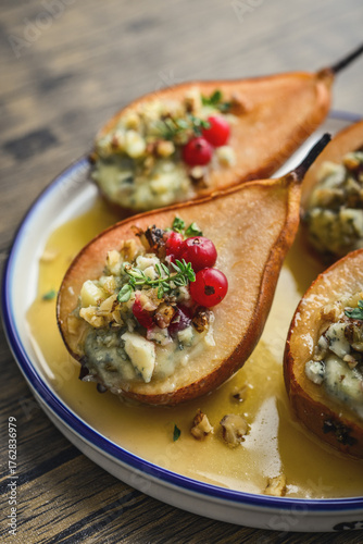Delicious baked pears with nuts, blue cheese, thyme, cranberry and honey