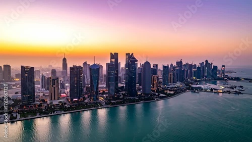 Wallpaper Mural Spectacular panoramic cityscape of a modern financial district with glass skyscrapers reflecting the colorful sunrise over the sea Torontodigital.ca