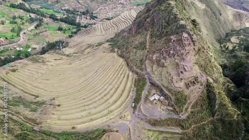 Pisac, Peru: Aerial drone footage of Sacred Valley in Pisac. An archeological site of Inca on mountaintop near Cusco. With downward motion showing the citadel ruins