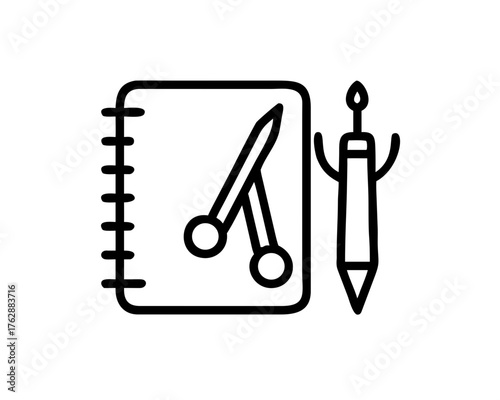 Notebook with scissors and pen for creative work