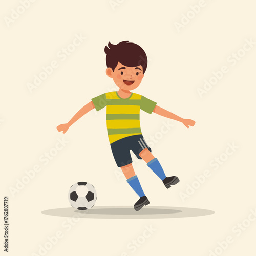 A cheerful young boy in a vibrant striped shirt enthusiastically kicks a soccer ball, embodying the joy of childhood sports and active play on a sunny day