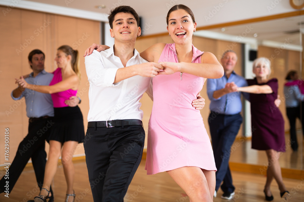 Fototapeta premium at dance lesson for beginners, young couple learn to dance jive