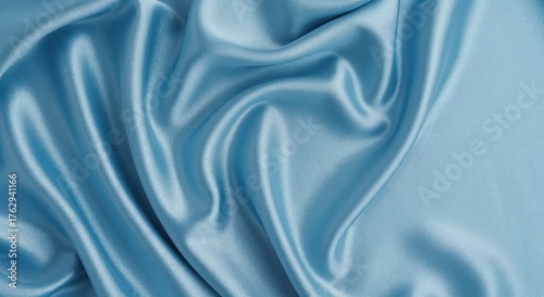 Azure Silk Serenity: A delicate display of flowing azure silk, showcasing its smooth texture and elegant drape, evokes a sense of refined beauty and luxury.