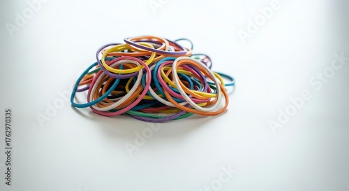 Wallpaper Mural Dynamic Stack of Assorted Vibrant Rubber Bands Against a Crisp White Backdrop Torontodigital.ca