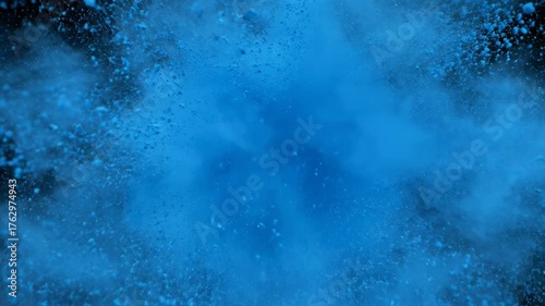 Blue Powder Explosion: A vibrant explosion of blue powder fills the frame, creating a mesmerizing display of color and texture, capturing the raw energy and dynamic force.