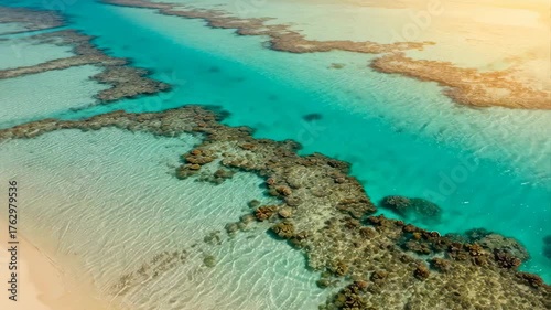 Aerial Drone View Of Crystal Clear Turquoise Water Over Coral Reefs And Sandy Beach At Golden Hour