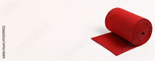 Red carpet roll on white background with copy space