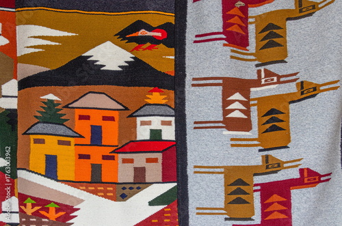 Colorful traditional wool rugs and blankets with Andean designs are sold at the Plaza de los Ponchos artisan market in Otavalo, Imbabura Province, Ecuador	
