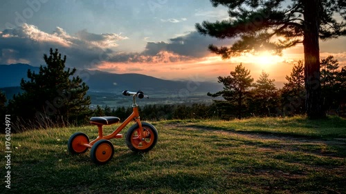 Kids’ Tricycle in a Forest Playground with Mountain View. Seamless looping time-lapse virtual 4k video animation background