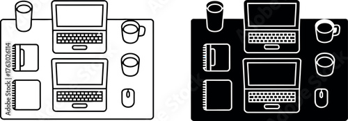 Workspace setup featuring laptops notebooks and coffee cups representing productivity and remote work culture concept