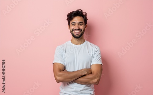 Photo of cheerful attractive handsome entrepreneur standing confidently with hands folded smiling beaming isolated over pastel color background. High quality