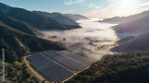 Scenic aerial view of solar panels spread across a lush valley under soft clouds, promoting renewable energy and eco progress.