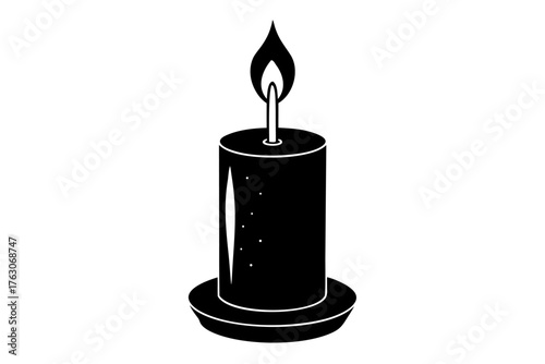 burning candle on black background