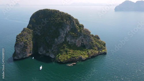 Aerial footage of Koh Waen or Waen Island, a small island in Andaman sea famous for scuba diving with unique artificial reef and vibrant coral reef located in Trang Province, Thailand.