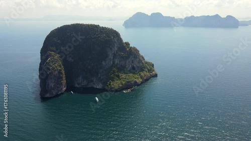 Aerial footage of Koh Waen or Waen Island, a small island in Andaman sea famous for scuba diving with unique artificial reef and vibrant coral reef located in Trang Province, Thailand.