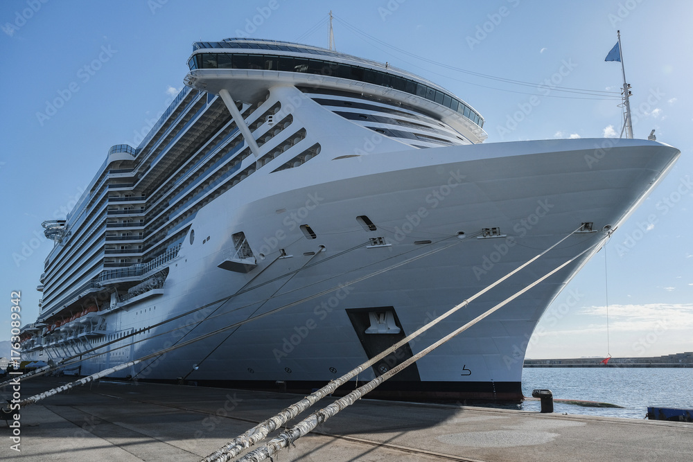 Naklejka premium Massive Italian family cruiseship cruise ship liner Seaside, Seaview or Seascape in port of Marseille Provence, France during Summer Mediterranean cruising in sleek modern design