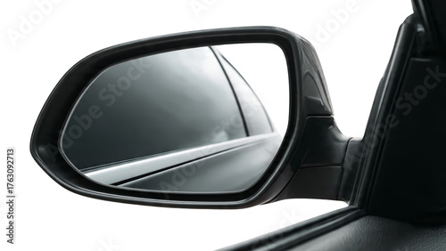 Close up of a car's side mirror reflecting a dark tinted window and exterior isolate